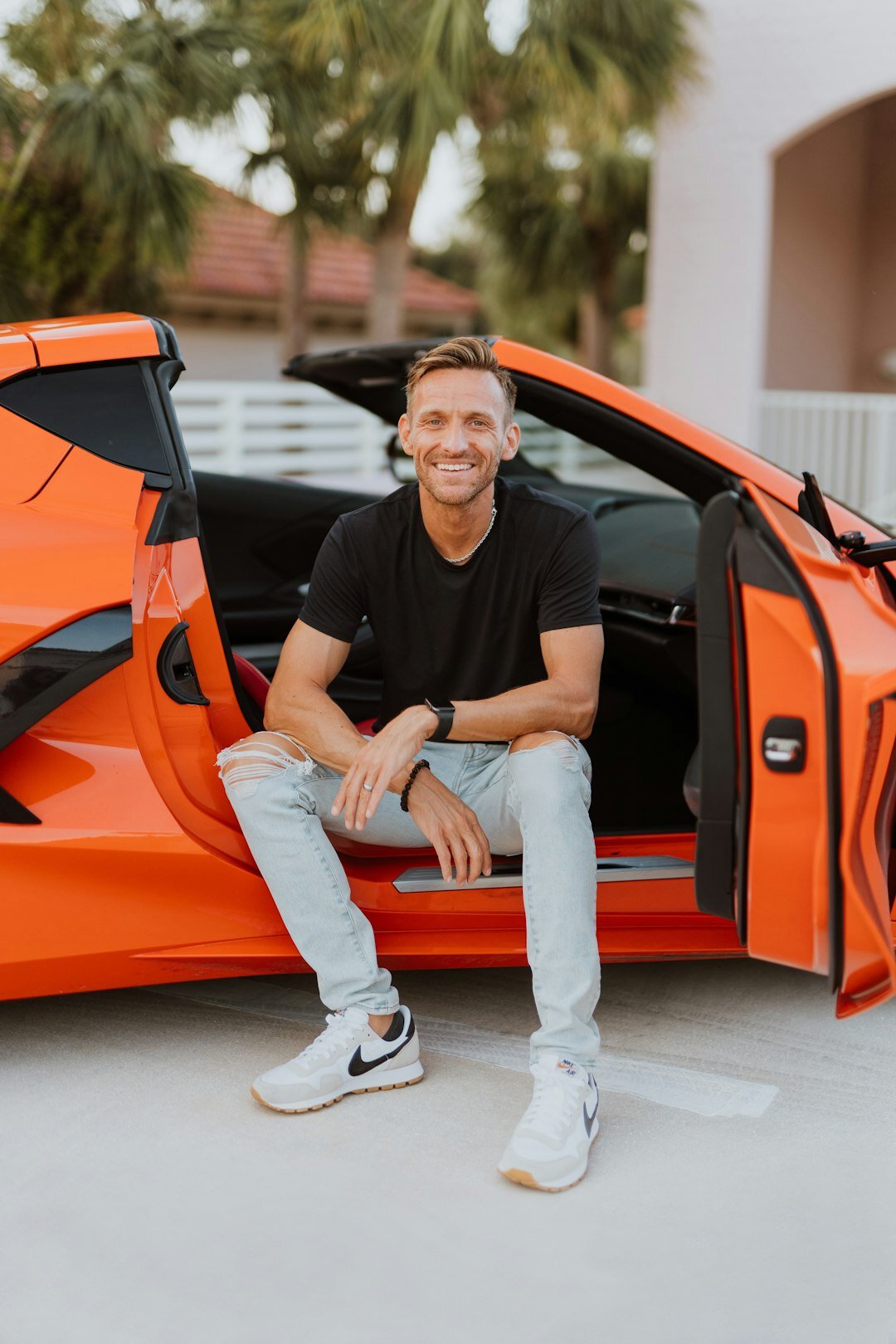 inspiring entrepreneur with car