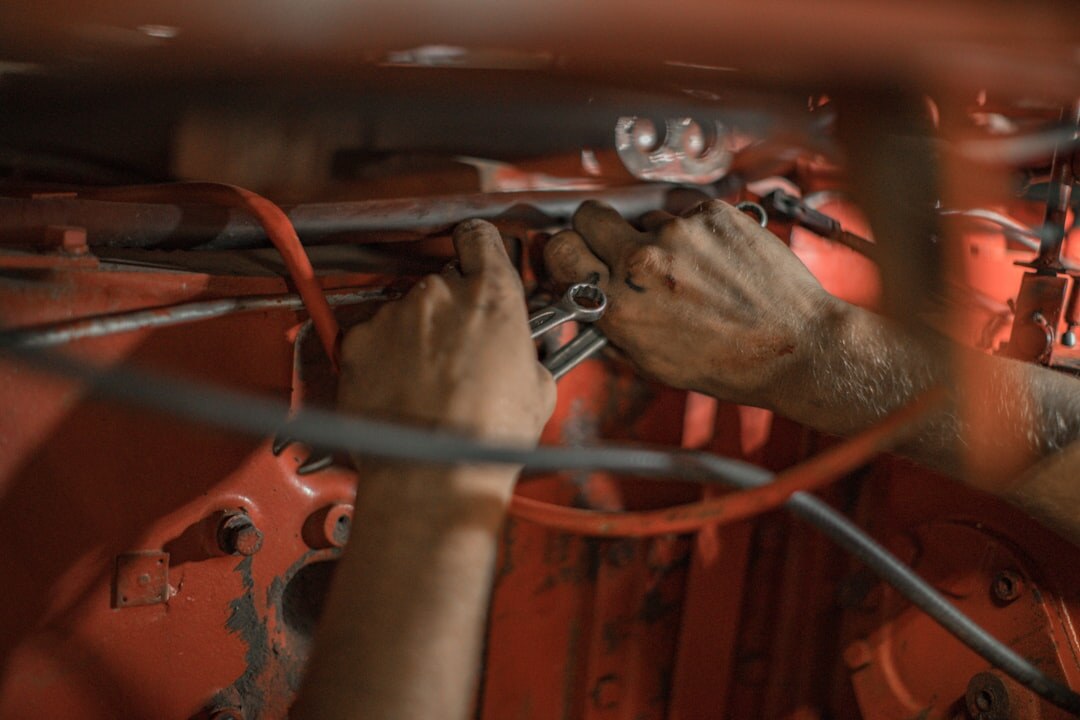 car mechanic inspecting engine