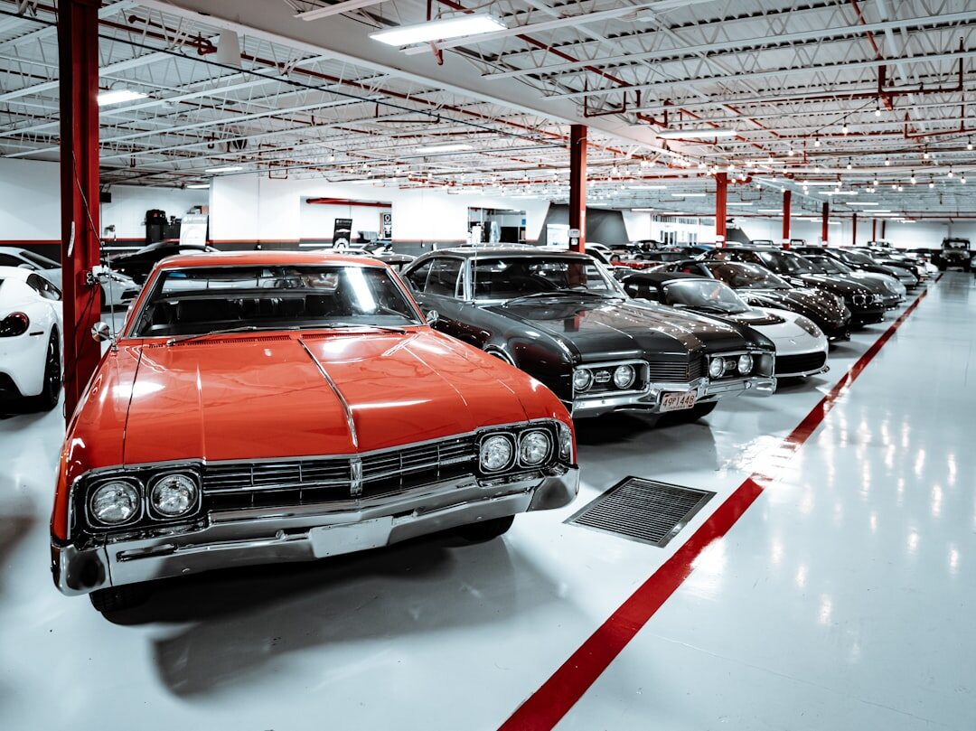 Wide shot of a private garage filled with rare classic and modern collector cars